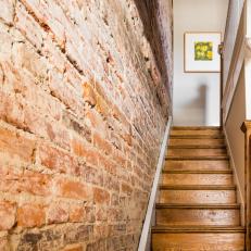 Exposed Brick Adds Sense of History to Eclectic Entryway