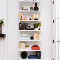 White Bookshelf and Wooden Clogs