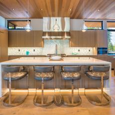 Modern Chef Kitchen With Gray Barstools