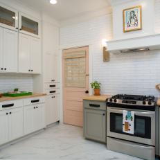 Modern White Kitchen with Pink Door