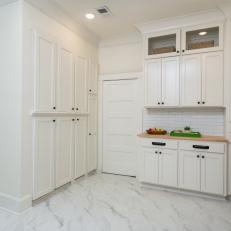Modern White Kitchen with White Marble Floors 