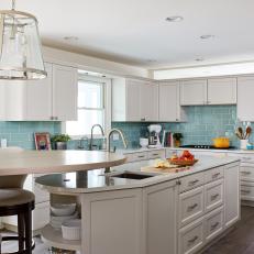 Gray Open Plan Kitchen With Blue Backsplash