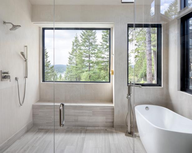A luxurious bathroom with a walk-in shower, freestanding bathtub