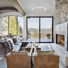 Modern Sitting Area Anchored By Sleek, Stone-Clad Fireplace