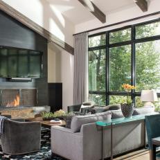 Modern Living Room Makes Statement With Sleek Black Fireplace