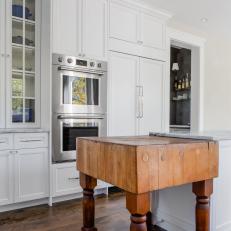 White Chef Kitchen With Butcher Block Table