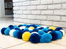 HGTV shows you how to make a fun and colorful pompom rug.