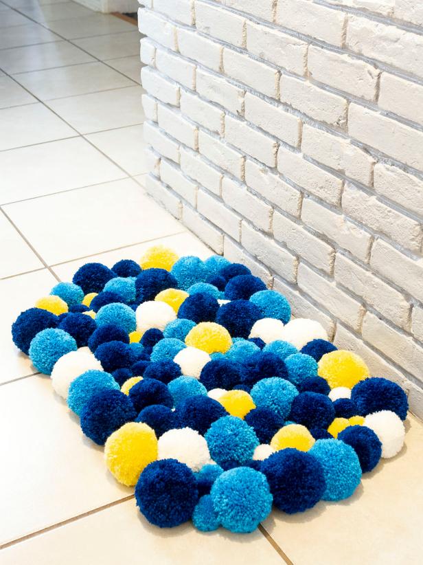 HGTV shows you how to make a fun and colorful pompom rug.