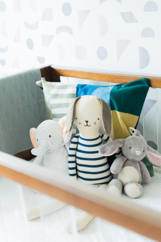 stuffed animals in crib