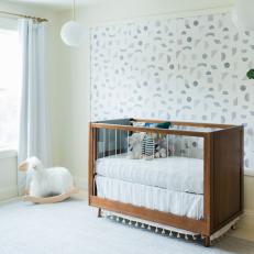 Neutral Contemporary Nursery With Geometric Wallpaper