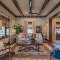 Neutral French Country Living Room with Brown Exposed Beams 