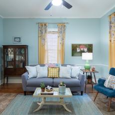 Contemporary Blue Living Room with Yellow Floral Curtains