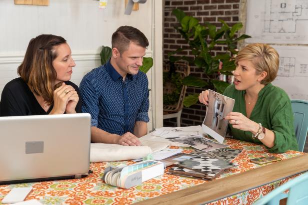 Erin Napier (R) works with designers Amanda Connolly (L) and Blake Erskin (C) to figure out the design for the kitchen at the Luker House in Laurel, Mississippi. (action)