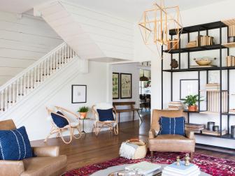 As seen on Fixer Upper, the Ramsey's remodeled living room has new floors, freshly painted walls, and new lighting. (After #3)