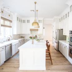 White Galley Kitchen With Gold Pendants