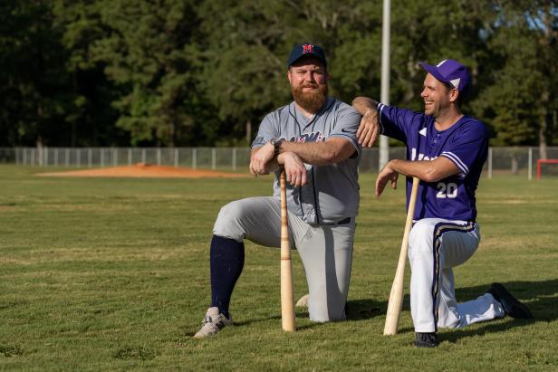 Ben Napier (C) and Jason Pickens (R) are on the field with the Emeralds youth team in Laurel, Mississippi swinging their newly turned baseball bats.  Ben and Jason joke after the game about how long it's been since they have played baseball. (action)