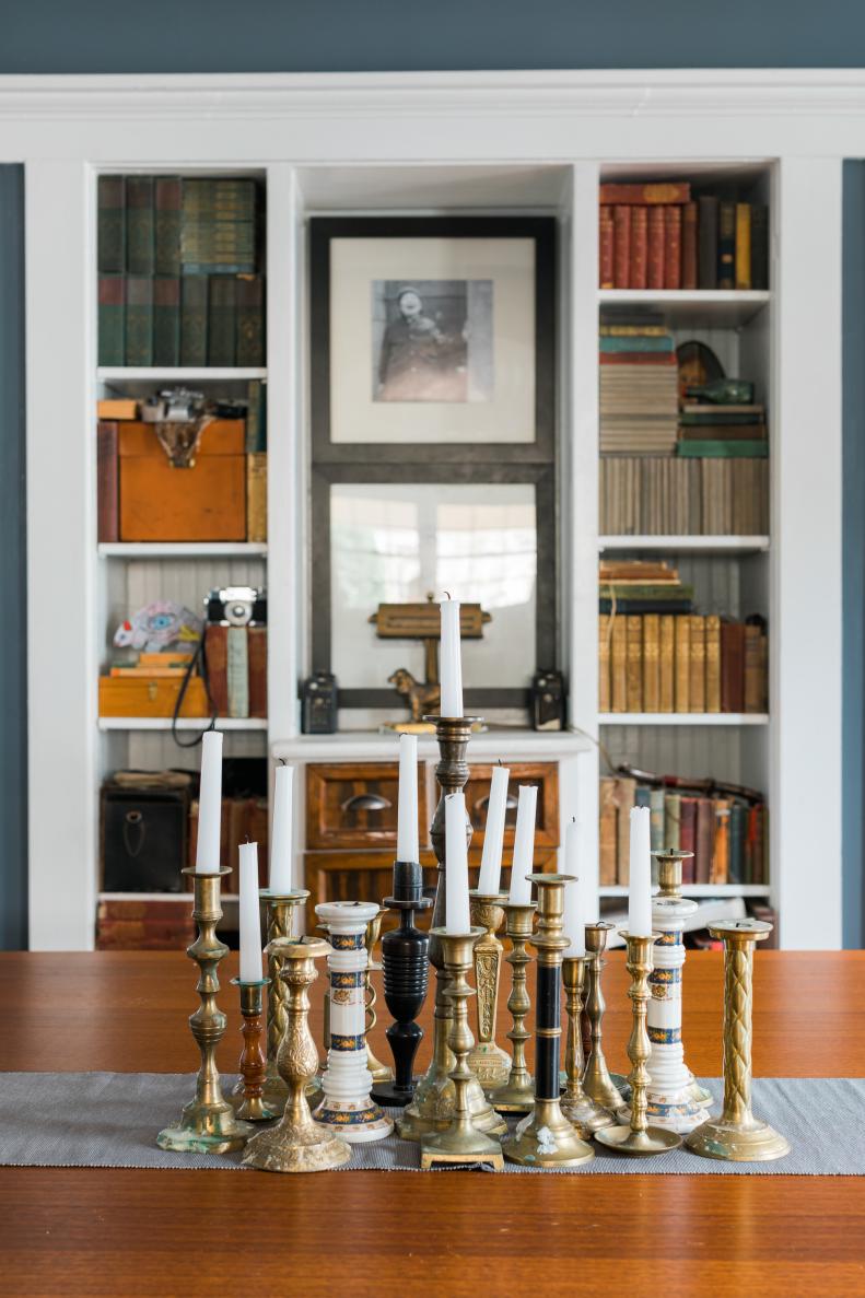 Mismatched Collection of Candlestick Holders on Dining Table