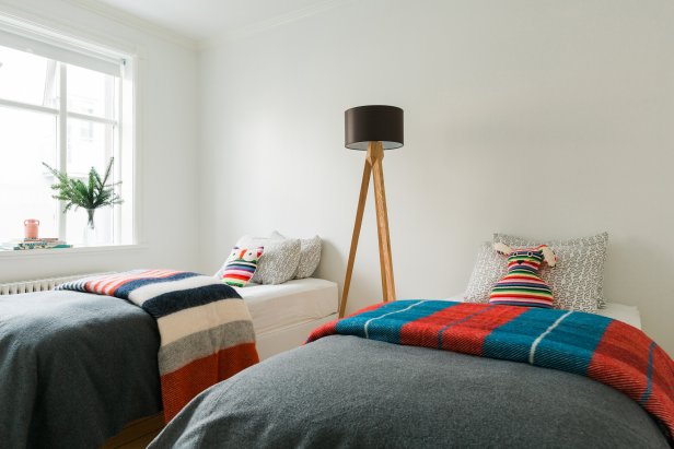 White Bedroom with Bold Patterned Blankets