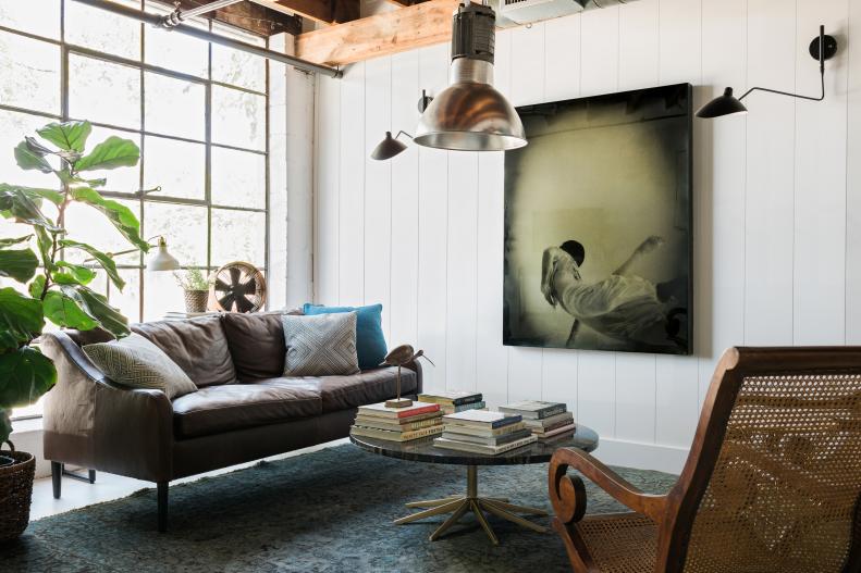 A playful loft space with fresh white planks and concrete walls. 