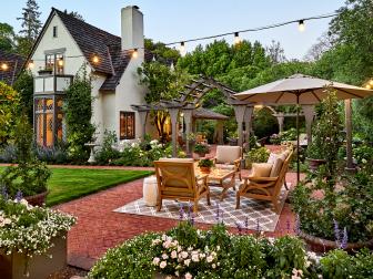 Tudor home with brick patio