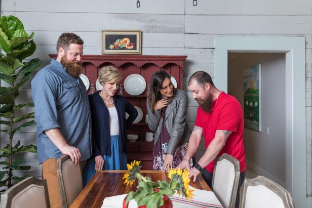 As seen on Home Town, Hosts Ben and Erin Napier watch as homeowner Cassidy (R) shows the work he did on dining table to Robyn (C) Rahaim in the new dining room of their renovated residence. (action)