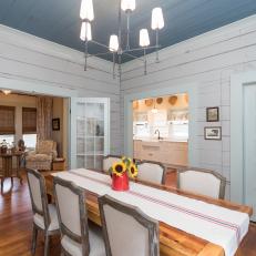Neutral Craftsman Dining Room with a Blue Ceiling