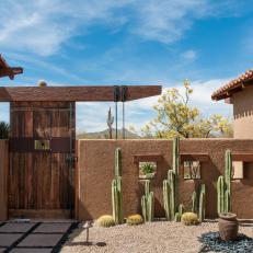 Southwestern Home With Wood Gate