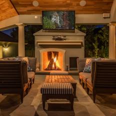 Outdoor Living Room With Fire and TV