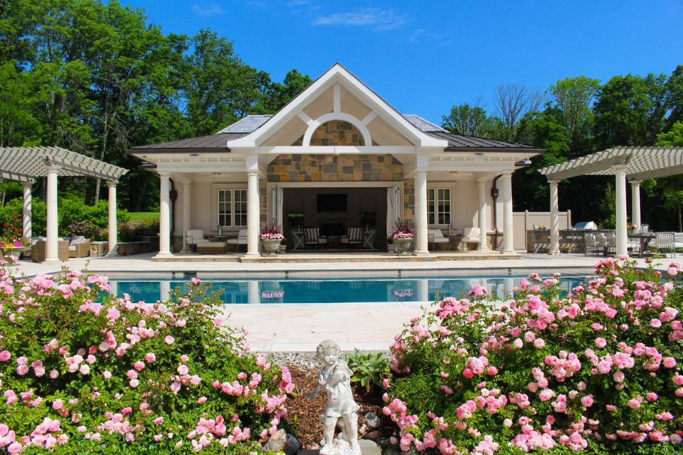 pool house with white pergolas