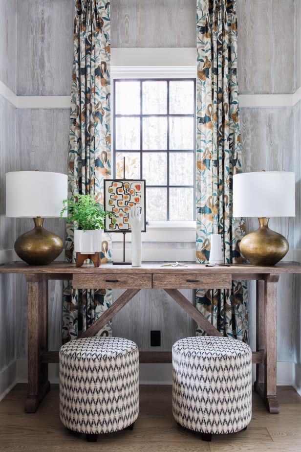 Transitional Foyer Has Console Table Paired With Small Drum Ottomans | HGTV