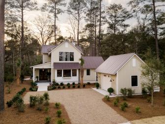 What was once an empty lot was transformed into an inviting front yard for this approximately 2,850 square foot farmhouse-inspired retreat located in Palmetto Bluff in South Carolina. 