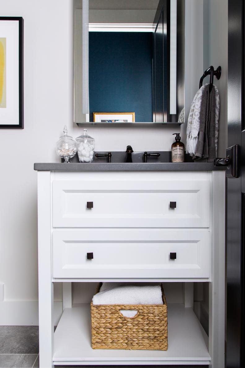 White Vanity With Gray Countertop in Small Bathroom
