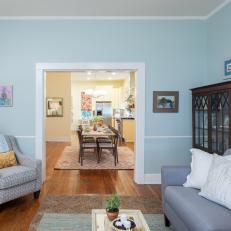 Contemporary Blue Living Room with Brown Hardwood Floors 