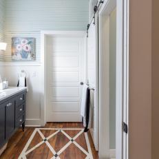 White Rustic Master Bathroom With White Door 