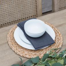 Neutral Wood Dining Table with White Dishware 