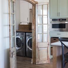 White Cottage Laundry Room with Brown French Doors 