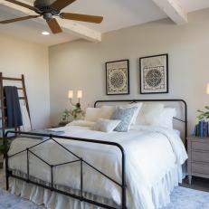 White Cottage Master Bedroom with Black Iron Bed 