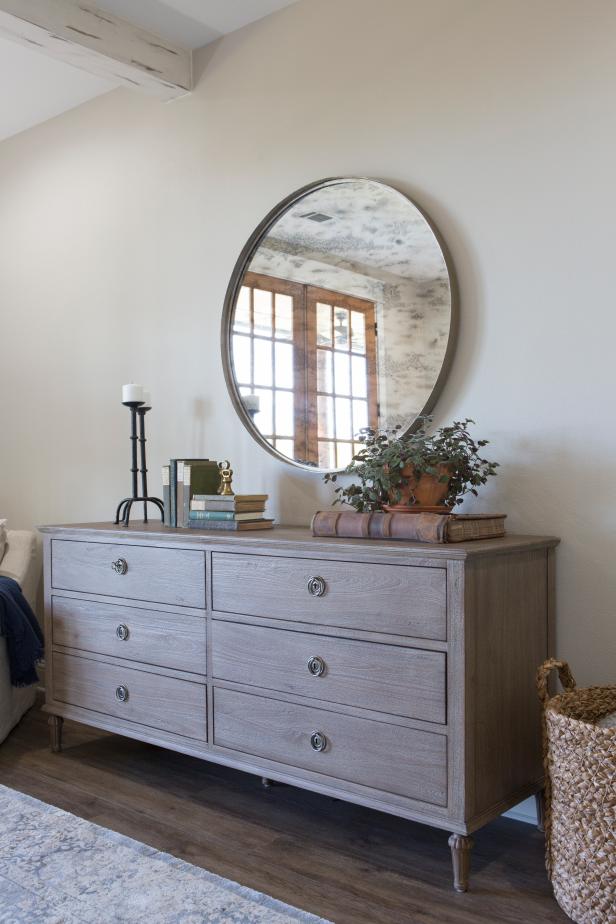 White Cottage Master Bedroom With Brown Dresser And Mirror Hgtv