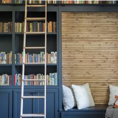 Blue Cottage Playroom with Blue Built-In Bookshelf 