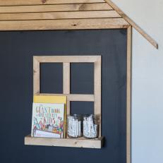 Blue Cottage Playroom with Chalkboard and Floating Shelf 