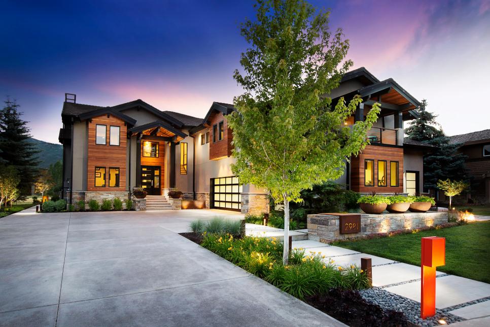 modern home with stone and wood exterior
