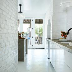 White Kitchen With White Brick Walls