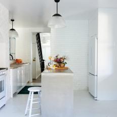 White Kitchen With Concrete Island 