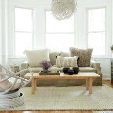 White Contemporary Living Room With Fringed Pillow
