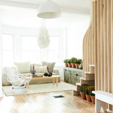 White Cottage Living Room With Railing