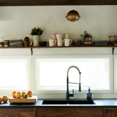Kitchen With Open Shelving and Oranges