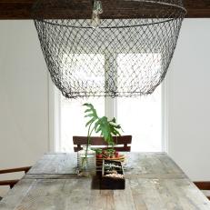 Chicken Wire Pendant Light and Wood Dining Table