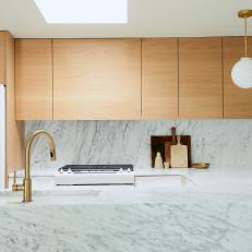 Modern Kitchen With Waterfall Marble Counter