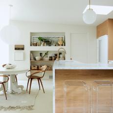 White Open Plan Kitchen With Lucite Stools