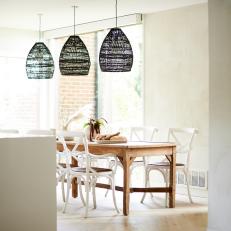 Open Plan Contemporary Dining Room With Dark Pendants